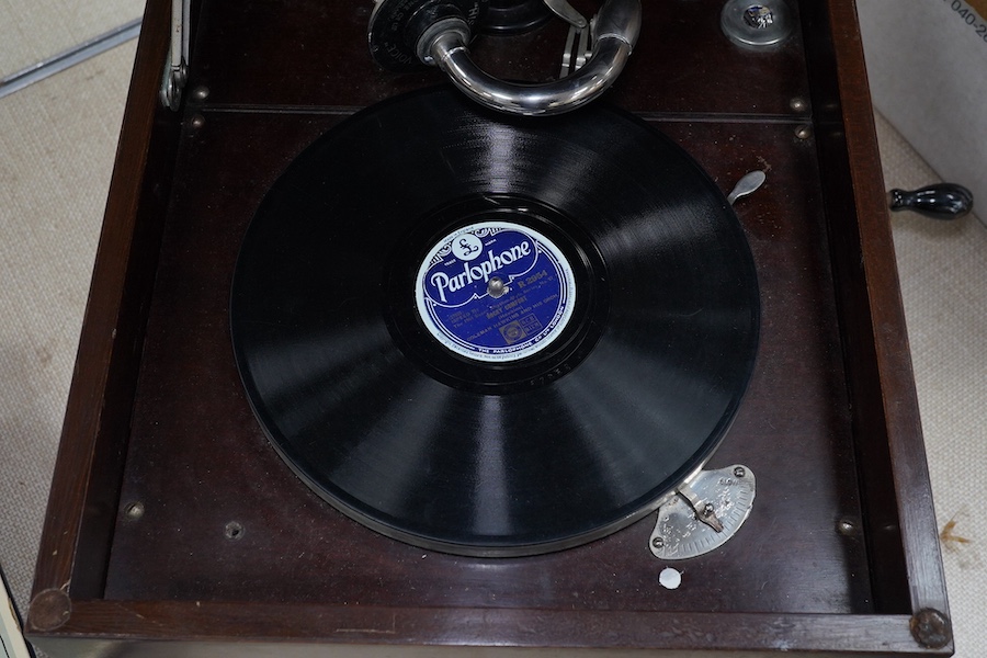 A mahogany cased HMV table top gramophone record player and a small selection of 78 rpm records. Condition - fair to good.